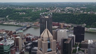 AX105_129 - 4.8K aerial stock footage flying over skyscrapers, Downtown Pittsburgh, Pennsylvania