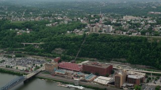 AX105_130 - 4.8K aerial stock footage flying over Station Square to suburbs, Pittsburgh, Pennsylvania
