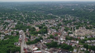 AX105_130E - 4.8K aerial stock footage flying over Station Square to suburbs, Pittsburgh, Pennsylvania