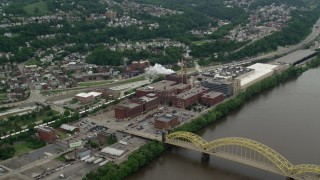 AX105_140 - 4.8K stock footage aerial video approaching HJ Heinz Plant, Pittsburgh, Pennsylvania