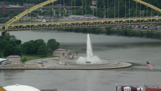 AX105_157 - 4.8K aerial stock footage of the fountain at Point State Park, Downtown Pittsburgh, Pennsylvania