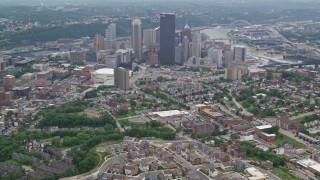 AX105_177E - 4.8K aerial stock footage approaching skyscrapers in Downtown Pittsburgh, Pennsylvania