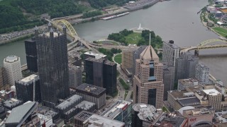 AX105_183E - 4.8K aerial stock footage flying over U.S. Steel Tower toward Point State Park in Downtown Pittsburgh, Pennsylvania