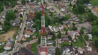 AX105_186E - 4.8K aerial stock footage of a radio tower in a suburb, Pittsburgh, Pennsylvania