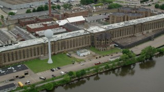 AX105_212 - 4.8K aerial stock footage orbiting Western State Penitentiary, Pittsburgh, Pennsylvania