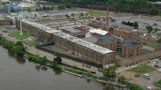 AX105_214 - 4.8K stock footage aerial video orbiting Western State Penitentiary, Pittsburgh