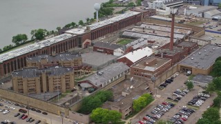 AX105_214E - 4.8K aerial stock footage orbiting the Western State Penitentiary, Pittsburgh
