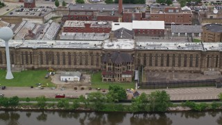 AX105_219E - 4.8K aerial stock footage of an old building, zoom to wider view of Western State Penitentiary, Pittsburgh, Pennsylvania
