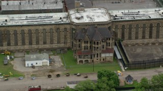 AX105_220 - 4.8K aerial stock footage of an old building at Western State Penitentiary, Pittsburgh, Pennsylvania