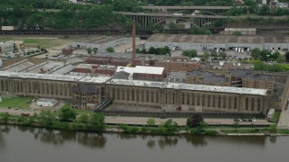 AX105_221 - 4.8K aerial stock footage orbiting Western State Penitentiary, Pittsburgh, Pennsylvania