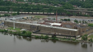 AX105_222 - 4.8K stock footage aerial video orbiting Western State Penitentiary, Pittsburgh, Pennsylvania