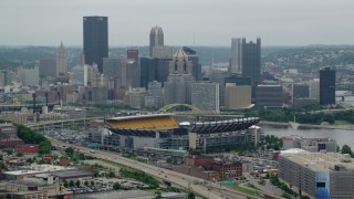 AX105_226 - 4.8K aerial stock footage of Heinz Field Football Stadium and Downtown Pittsburgh, Pennsylvania