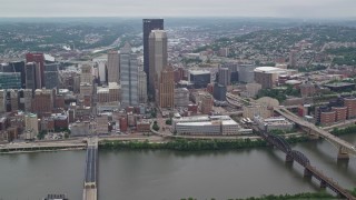 AX105_233 - 4.8K aerial stock footage orbiting skyscrapers near the river, Downtown Pittsburgh, Pennsylvania