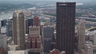 AX105_235 - 4.8K aerial stock footage of skyscrapers and small river ridges, Downtown Pittsburgh, Pennsylvania