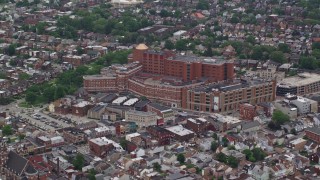 AX105_238E - 4.8K aerial stock footage approaching suburbs and a hospital, Pittsburgh, Pennsylvania