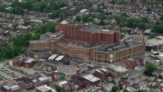 AX105_240 - 4.8K aerial stock footage approaching Western Pennsylvania Hospital, Pittsburgh, Pennsylvania