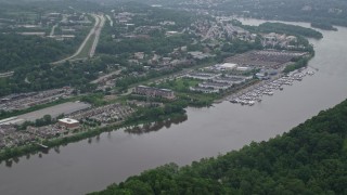 AX105_246E - 4.8K aerial stock footage of riverfront office buildings and marina, Pittsburgh, Pennsylvania