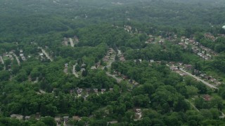 AX105_248 - 4.8K aerial stock footage orbiting a suburban neighborhood, Verona, Pennsylvania