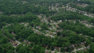 AX105_249 - 4.8K aerial stock footage orbiting a suburban neighborhood, Verona, Pennsylvania