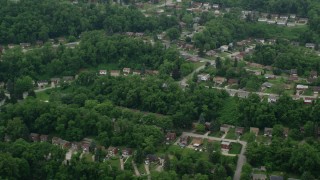 AX105_250 - 4.8K aerial stock footage orbiting a suburban neighborhood, Verona, Pennsylvania