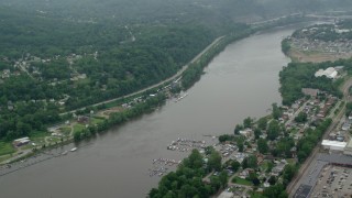 AX105_253 - 4.8K aerial stock footage orbiting Allegheny River, Verona, Pennsylvania