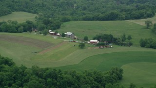 AX105_257 - 4.8K aerial stock footage of a ranch house and a red barn, Pittsburgh, Pennsylvania