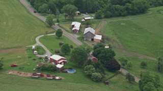 AX105_257E - 4.8K aerial stock footage of a ranch house and a red barn, Pittsburgh, Pennsylvania