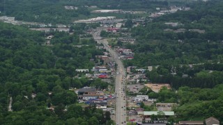 AX106_013E - 4.8K aerial stock footage of shops by the Highway through Allison Park, Pennsylvania