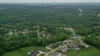 AX106_020 - 4.8K aerial stock footage flying over upscale homes near woods, Gibsonia, Pennsylvania