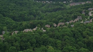 AX106_021 - 4.8K aerial stock footage of upscale homes by the woods, Wexford, Pennsylvania