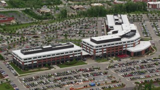 AX106_023E - 4.8K aerial stock footage of a modern office building, Cranberry Township, Pennsylvania