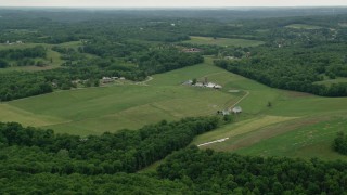 AX106_042 - 4.8K aerial stock footage approaching a farmhouse and farmland, Beaver Falls, Pennsylvania