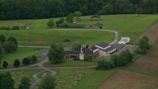 AX106_043 - 4.8K aerial stock footage orbiting a rural church in Beaver Falls, Pennsylvania