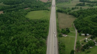 AX106_053 - 4.8K aerial stock footage flying over Interstate 76 with Light Traffic in New Galilee, Pennsylvania