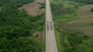 AX106_054 - 4.8K aerial stock footage of light traffic on Interstate 76 in New Galilee, Pennsylvania