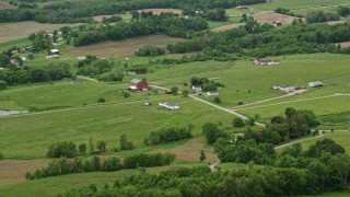AX106_057E - 4.8K aerial stock footage of red barns and farmhouses in Enon Valley, Pennsylvania