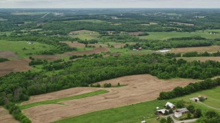 AX106_059 - 4.8K aerial stock footage of farms and trees in Enon Valley, Pennsylvania