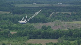 AX106_065 - 4.8K aerial stock footage of a tall crane by a forest in Enon Valley, Pennsylvania