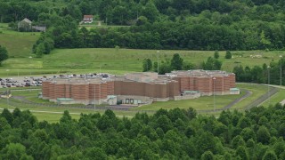 AX106_077E - 4.8K aerial stock footage approaching Ohio State Penitentiary, Youngstown, Ohio