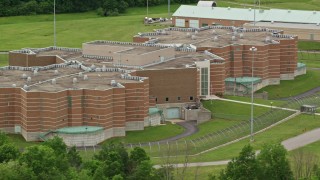 AX106_083E - 4.8K aerial stock footage of the front of Ohio State Penitentiary, Youngstown, Ohio