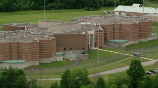 AX106_084 - 4.8K aerial stock footage of the front of Ohio State Penitentiary, Youngstown, Ohio