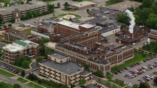 AX106_099E - 4.8K aerial stock footage approaching a hospital complex, Youngstown, Ohio