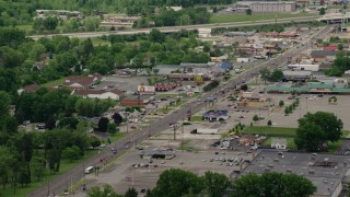 AX106_101 - 4.8K aerial stock footage of a city street, shops and strip mall in Youngstown, Ohio