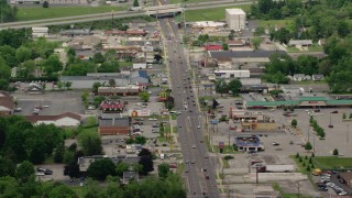 AX106_102 - 4.8K aerial stock footage shops and strip mall by busy street in Youngstown, Ohio