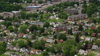 AX106_104 - 4.8K aerial stock footage of church and homes in Youngstown, Ohio