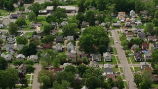 AX106_110E - 4.8K aerial stock footage of suburban residential neighborhood, Niles, Ohio
