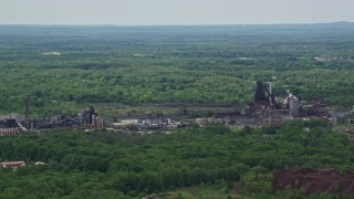 AX106_112 - 4.8K aerial stock footage of a steel and mining factory in Warren, Ohio