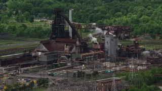 AX106_113E - 4.8K aerial stock footage of a steel and mining factory in Warren, Ohio