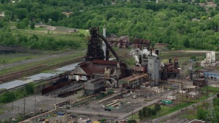 AX106_115 - 4.8K aerial stock footage of a steel and mining factory in Warren, Ohio