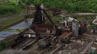 AX106_115E - 4.8K aerial stock footage of a steel and mining factory in Warren, Ohio